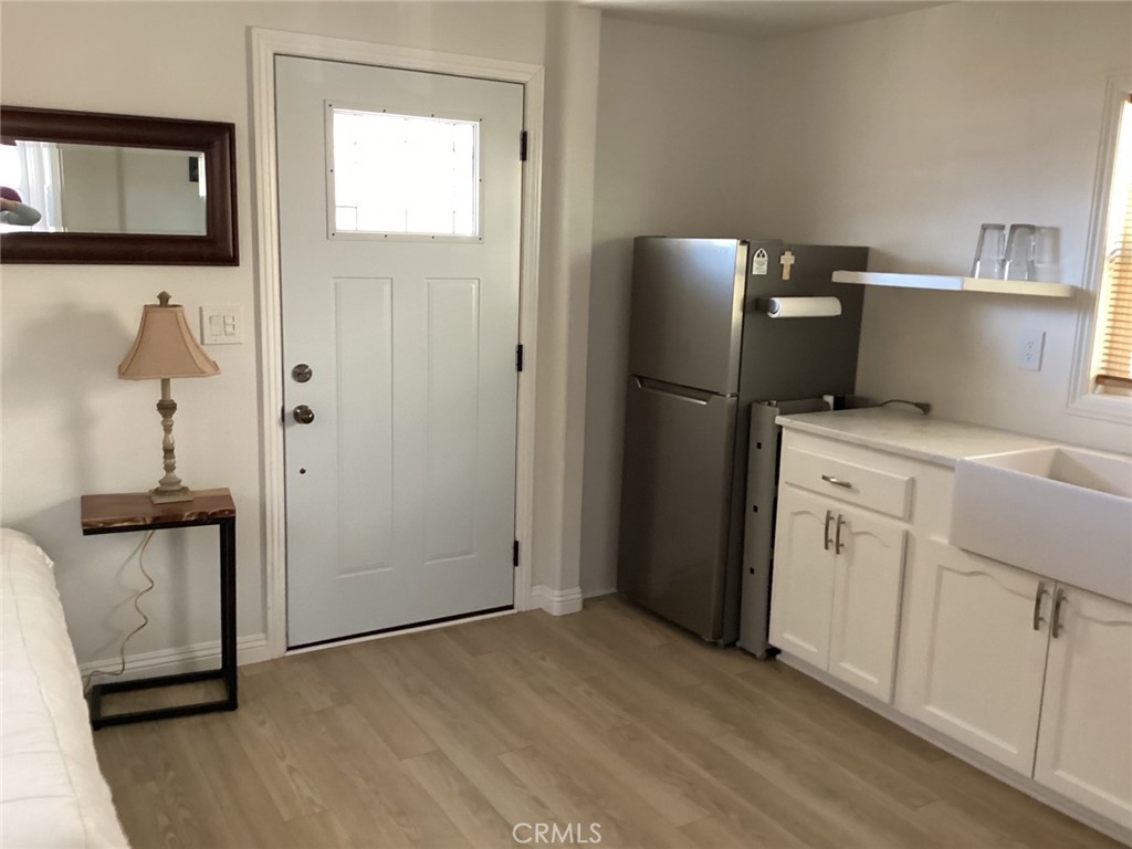 7165 Ridgeline Drive Jurupa Valley, CA 92509 - Photo 2 of 5 a view of cabinets with wooden floor and cabinet