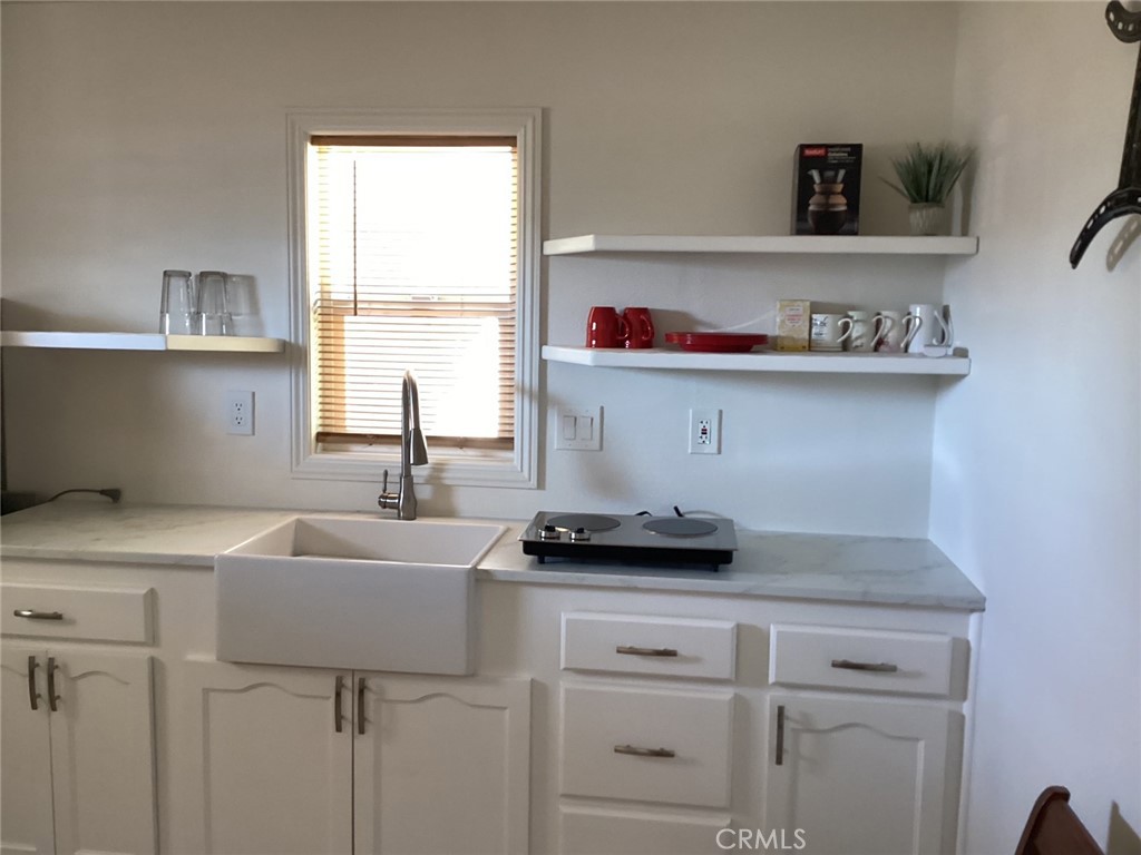 7165 Ridgeline Drive Jurupa Valley, CA 92509 - Photo 4 of 5 a kitchen with a sink and a stove