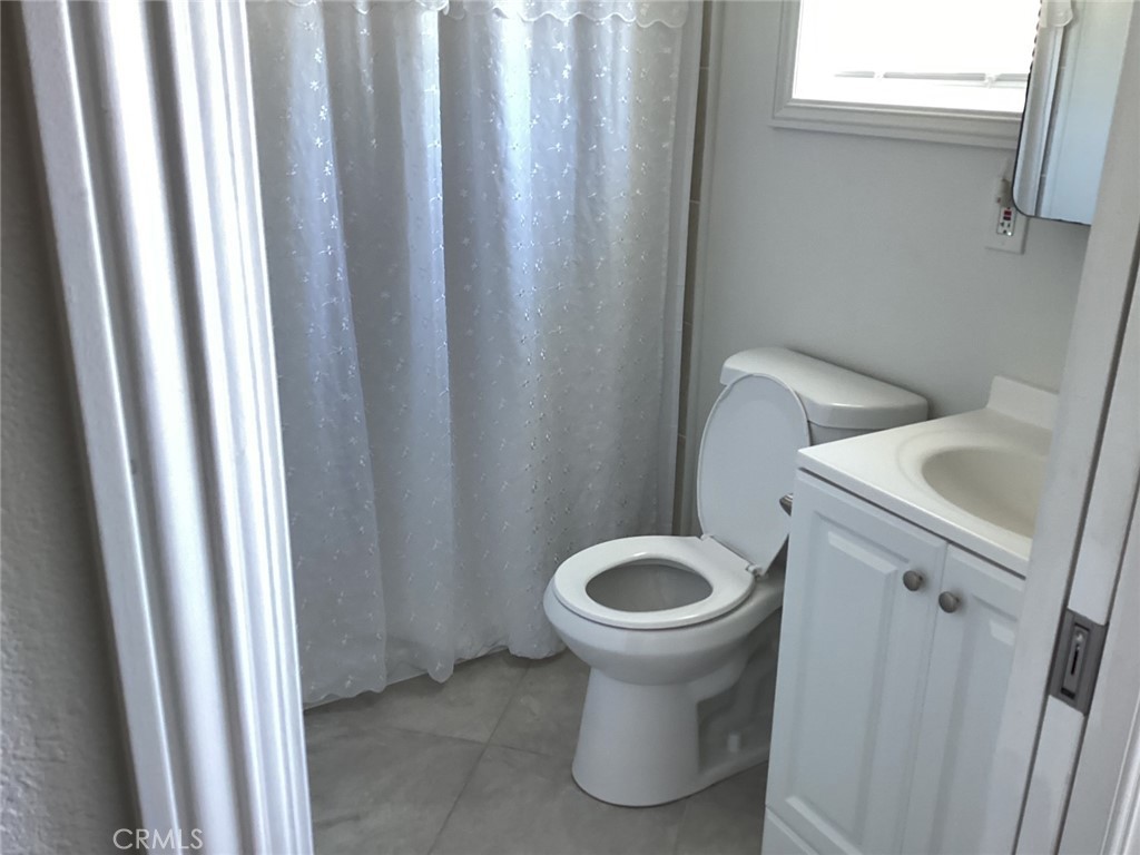 7165 Ridgeline Drive Jurupa Valley, CA 92509 - Photo 5 of 5 a bathroom with a sink and mirror