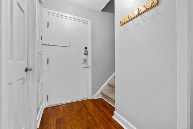 an aerial view of a house with a garden space and sitting space