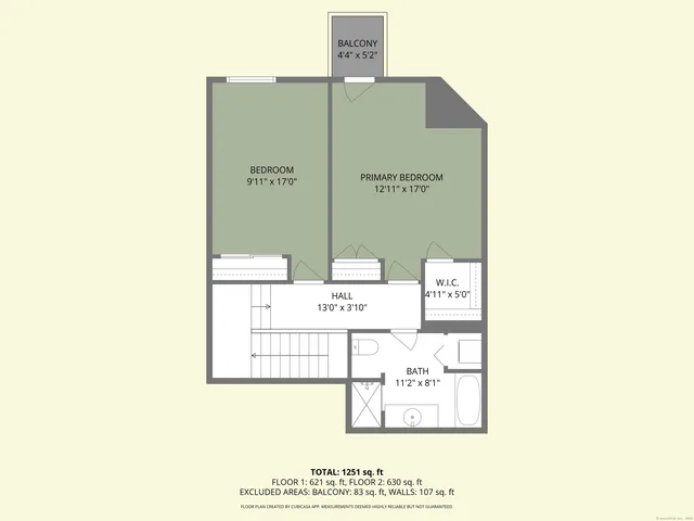 a living room with furniture a rug and a chandelier