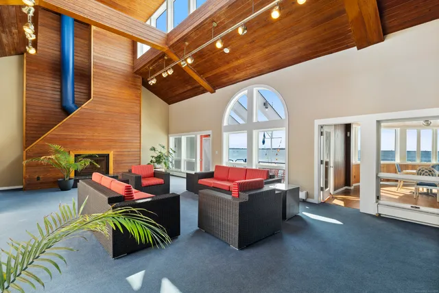 a view of a swimming pool with outdoor seating