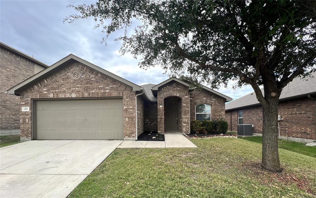 412 Copper Ridge Road Fort Worth, TX 76052 - Photo 1 of 1 a front view of house with yard and trees