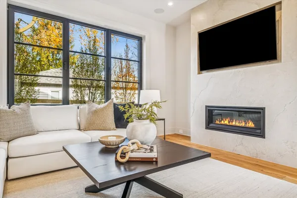 a kitchen with stainless steel appliances kitchen island granite countertop a kitchen island a stove a table and chairs