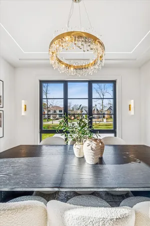 a living room with furniture a window and a table