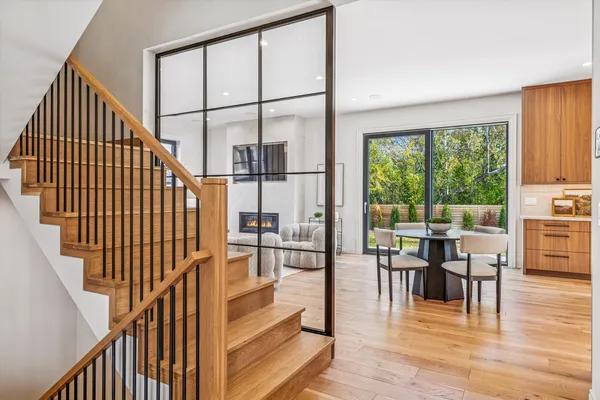 a living room with furniture and floor to ceiling windows