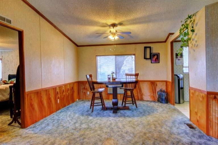 8085 High Banks Road Central Point, OR 97502 - Photo 12 of 35 a view of a dining room with furniture and chandelier