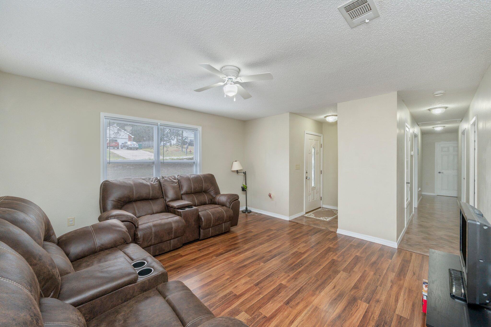 384 John King Road Crestview, FL 32539 - Photo 1 of 19 a living room with furniture and a flat screen tv