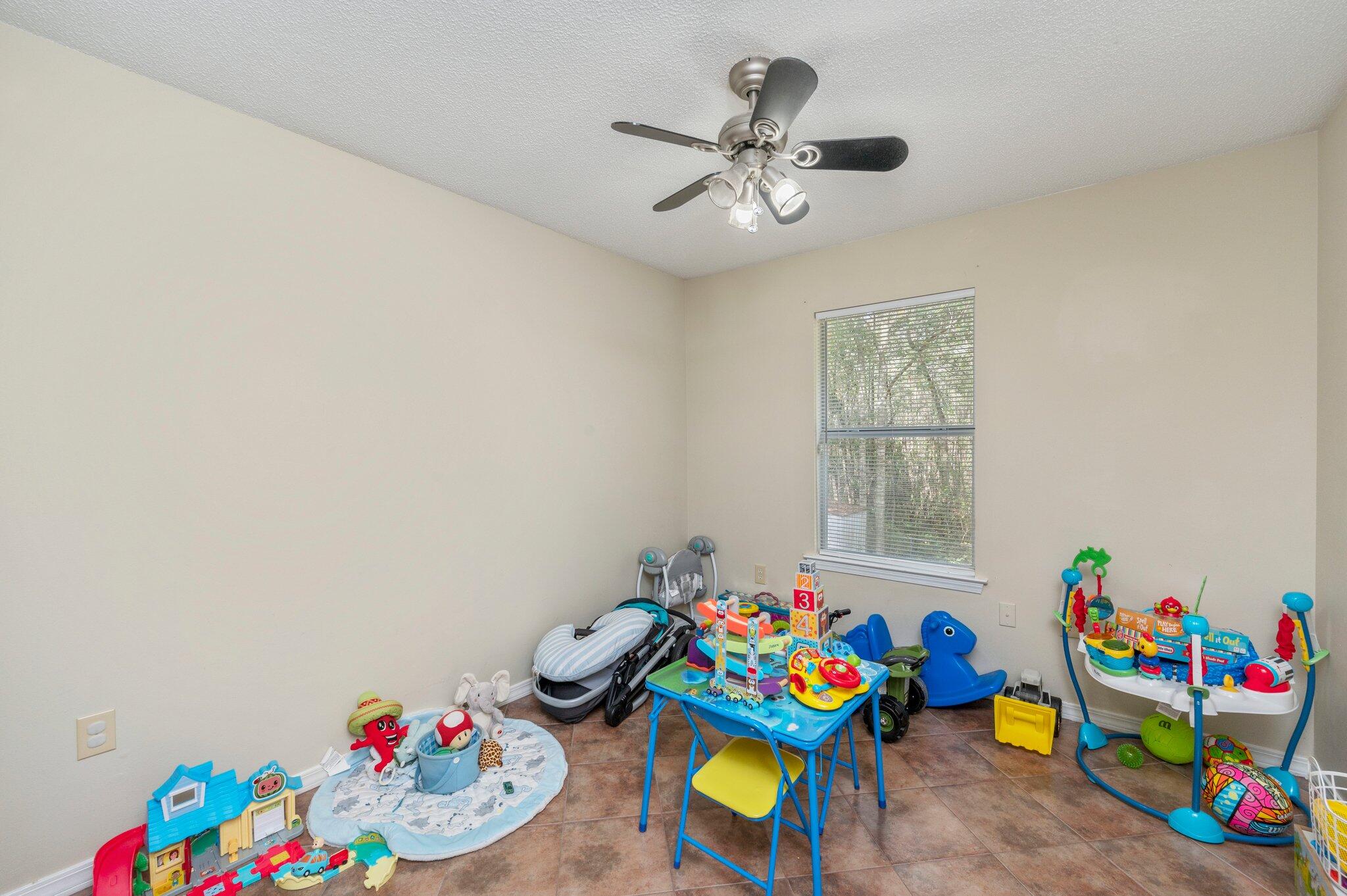 384 John King Road Crestview, FL 32539 - Photo 11 of 19 a play room with toys