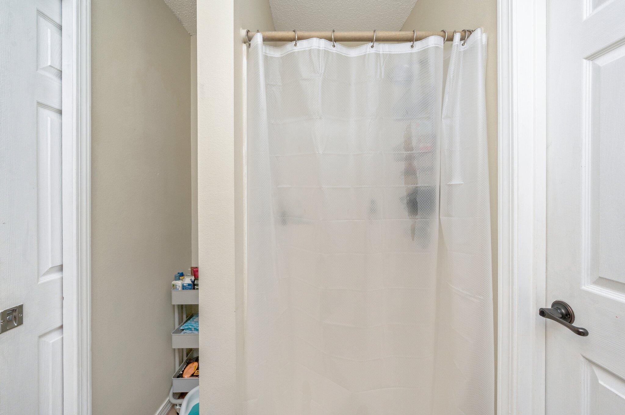 384 John King Road Crestview, FL 32539 - Photo 15 of 19 a bathroom with a shower curtain and a curtain