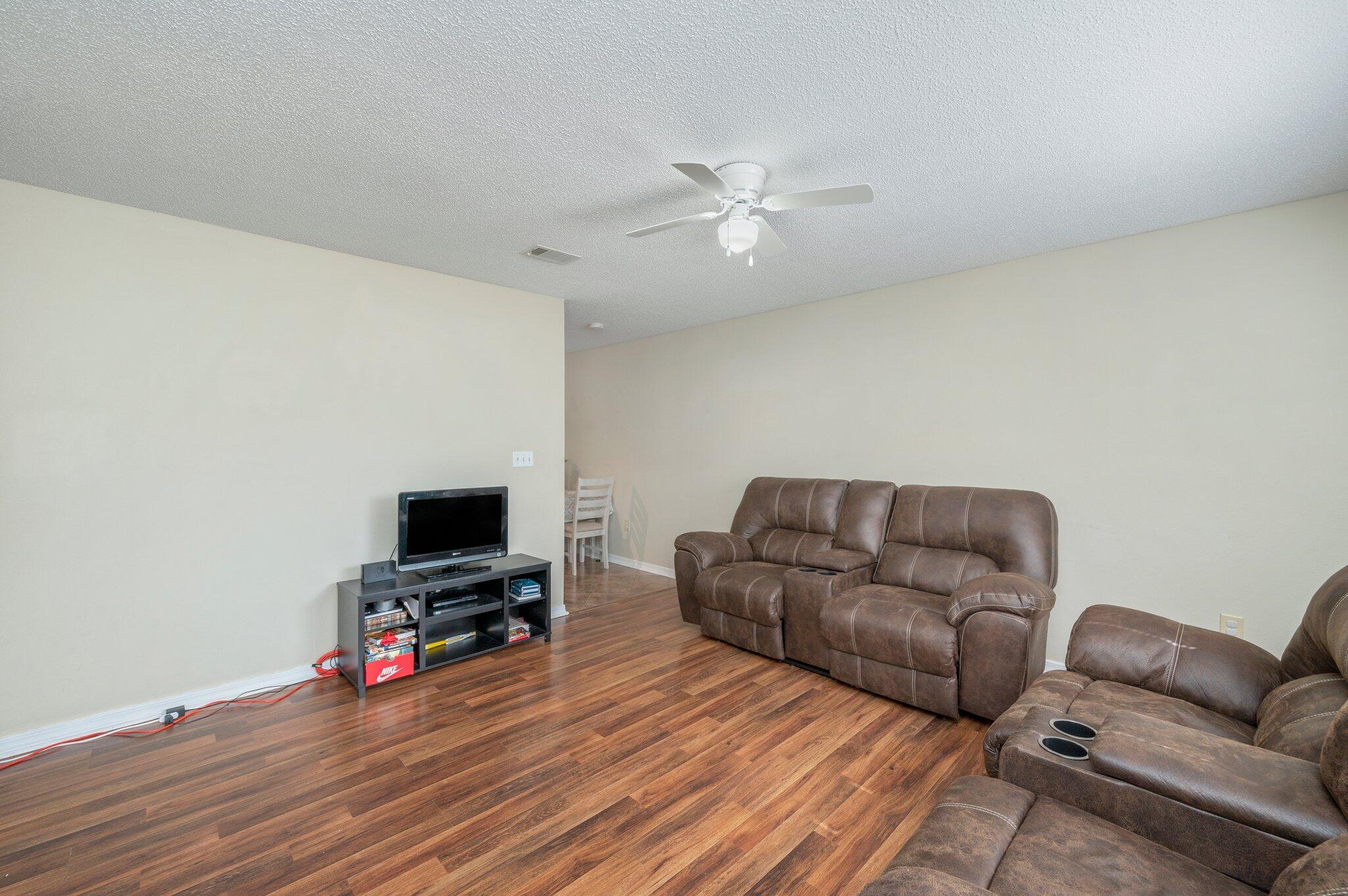 384 John King Road Crestview, FL 32539 - Photo 2 of 19 a living room with furniture and a flat screen tv