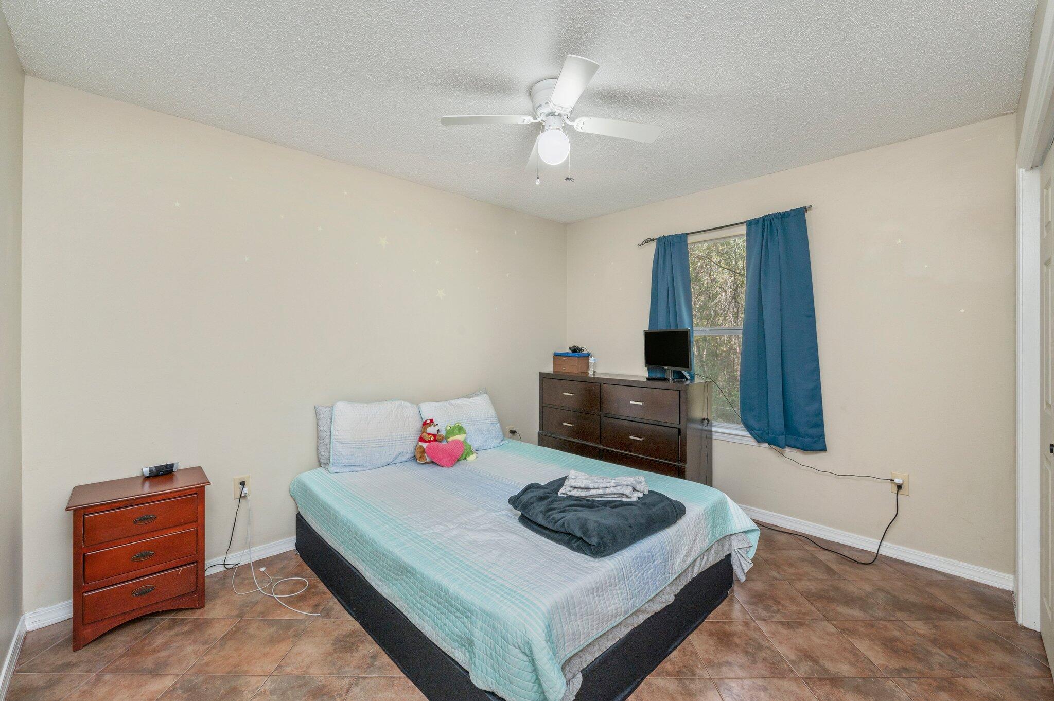 384 John King Road Crestview, FL 32539 - Photo 4 of 19 a living room with furniture and a table