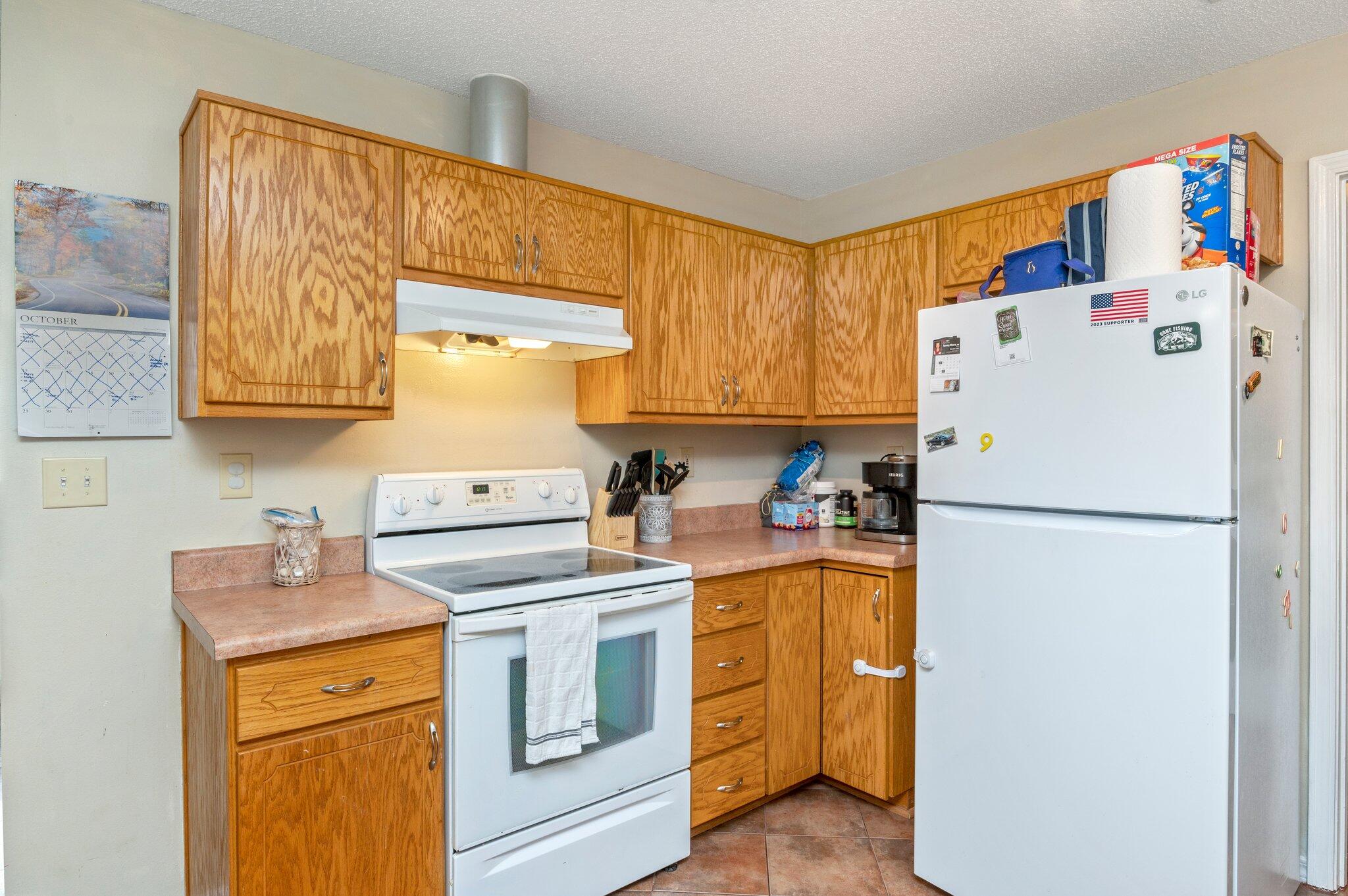 384 John King Road Crestview, FL 32539 - Photo 6 of 19 a white refrigerator freezer sitting in a kitchen