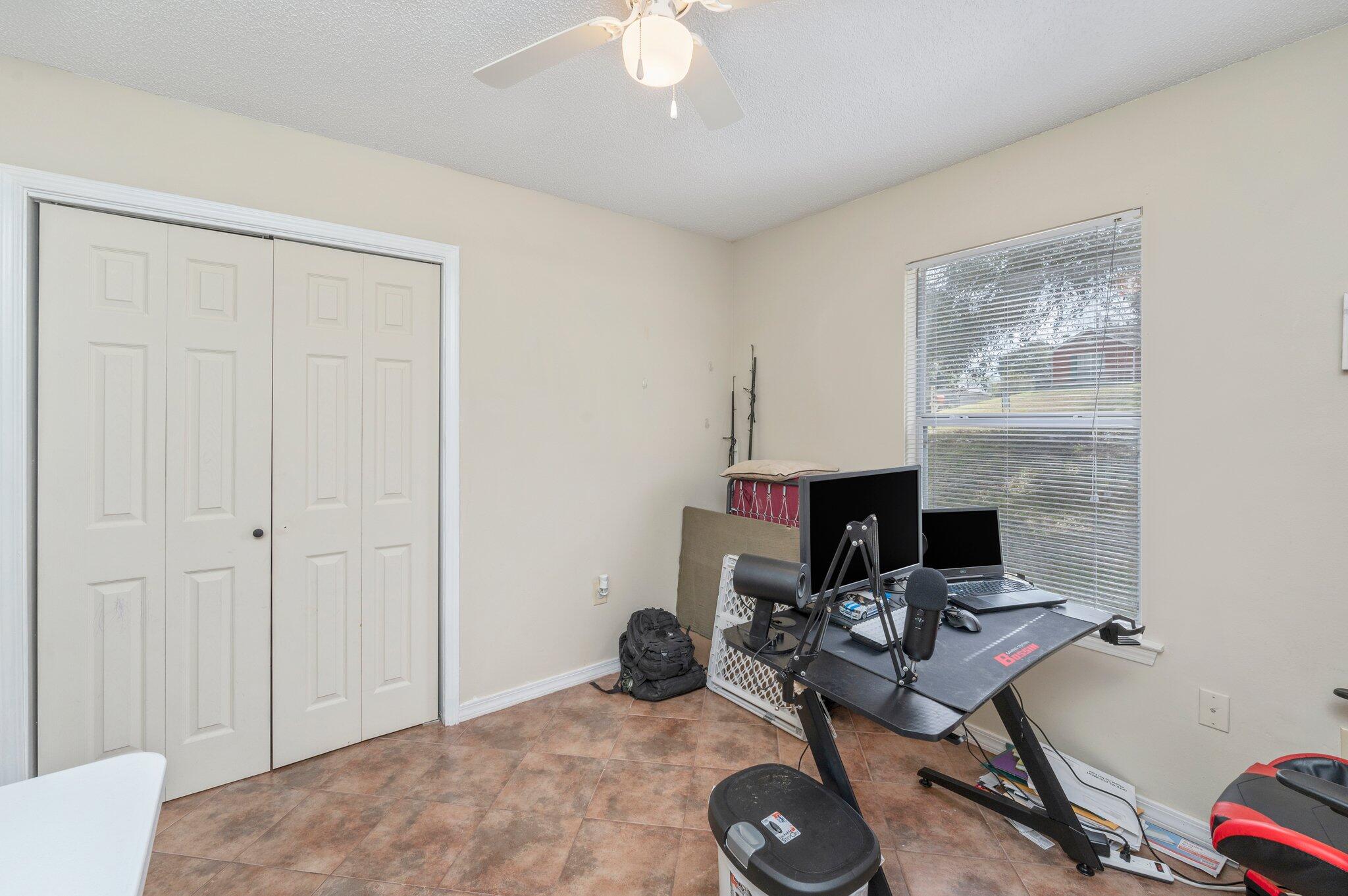 384 John King Road Crestview, FL 32539 - Photo 9 of 19 a workspace with furniture and a chandelier