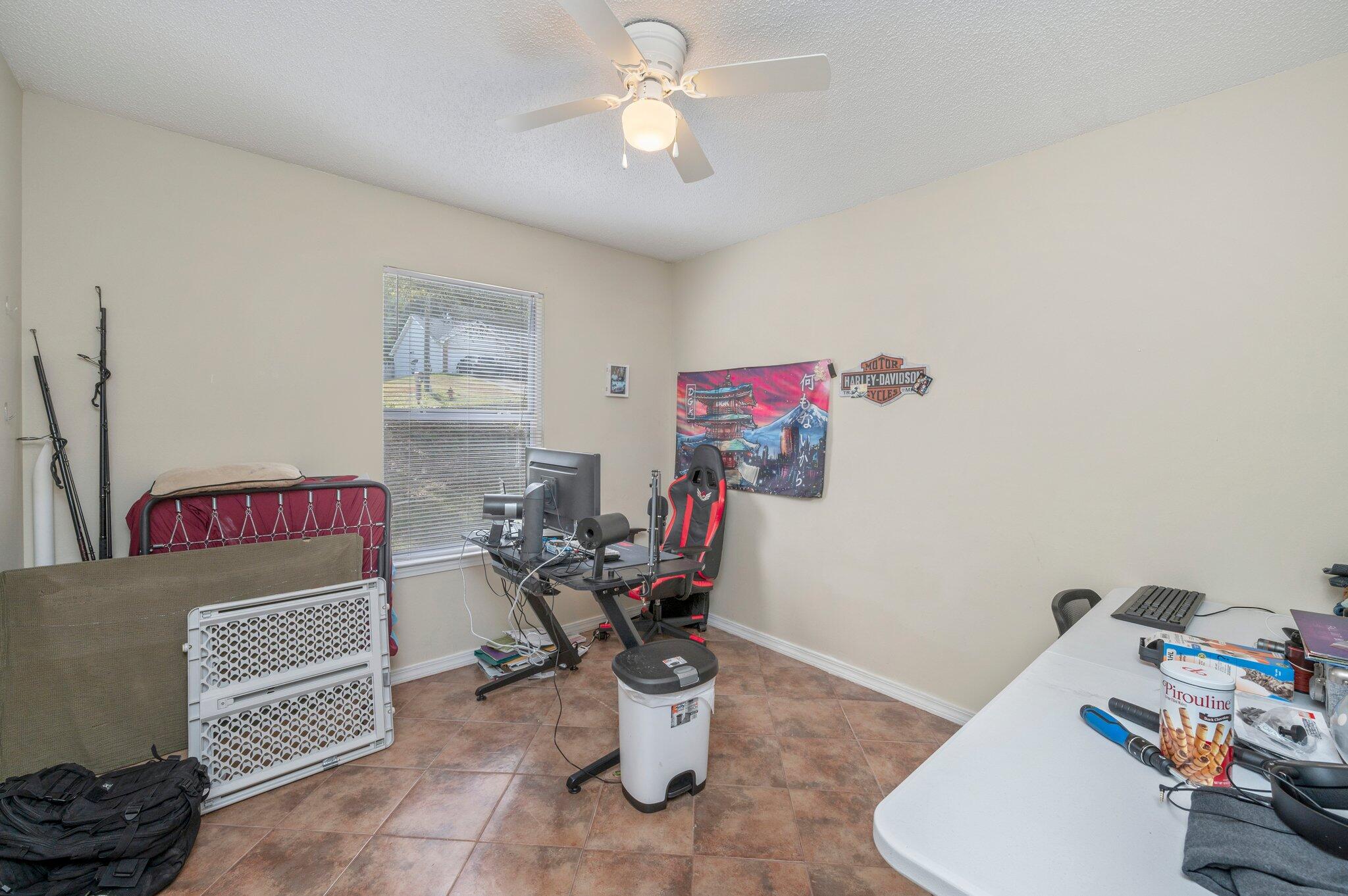 384 John King Road Crestview, FL 32539 - Photo 10 of 19 a living room with furniture and a chandelier