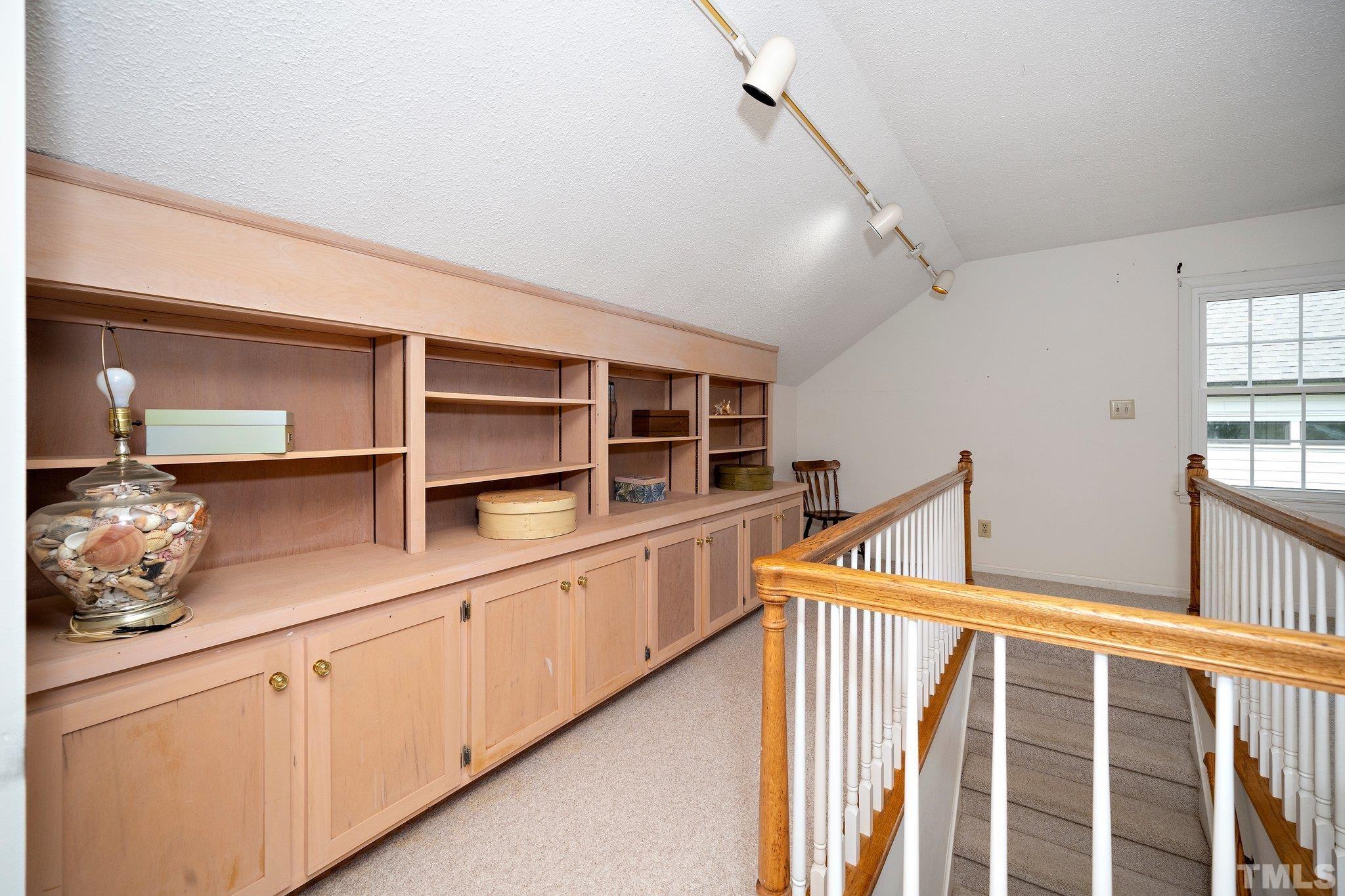 1512 Pony Run Road Raleigh, NC 27615 - Photo 20 of 39 a hallway with cabinets