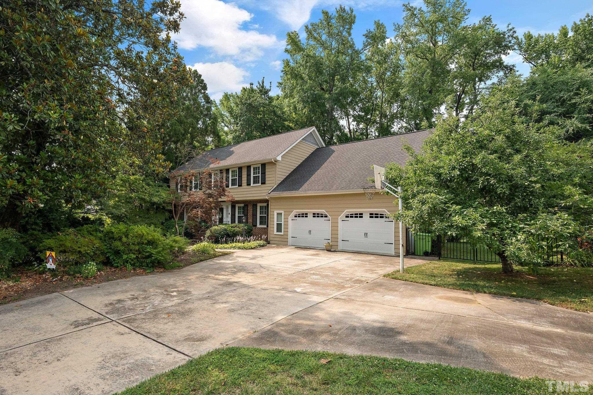 1512 Pony Run Road Raleigh, NC 27615 - Photo 8 of 39 a view of a house with a yard and large trees