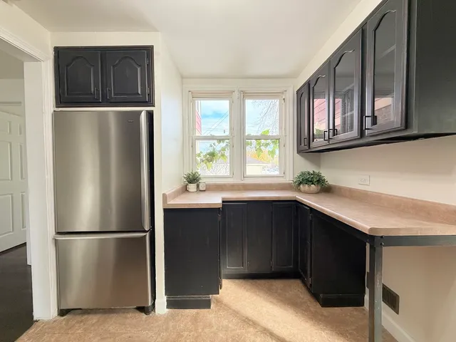 a kitchen with a stove and a refrigerator