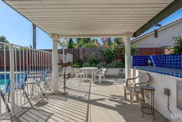 a patio with table and chairs