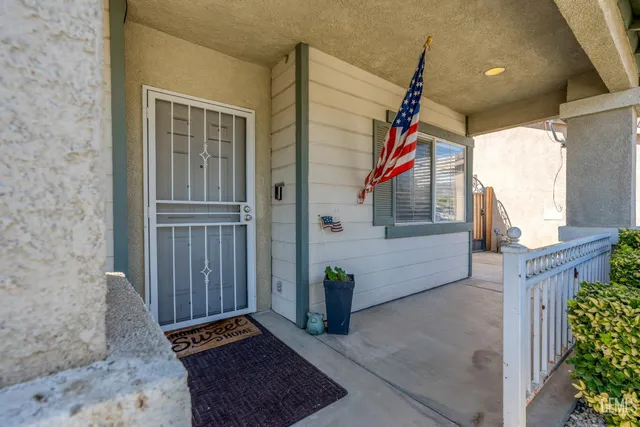 a view of a house with entryway and wooden floor