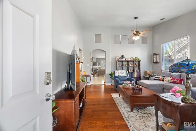 a living room with furniture fireplace and a chandelier
