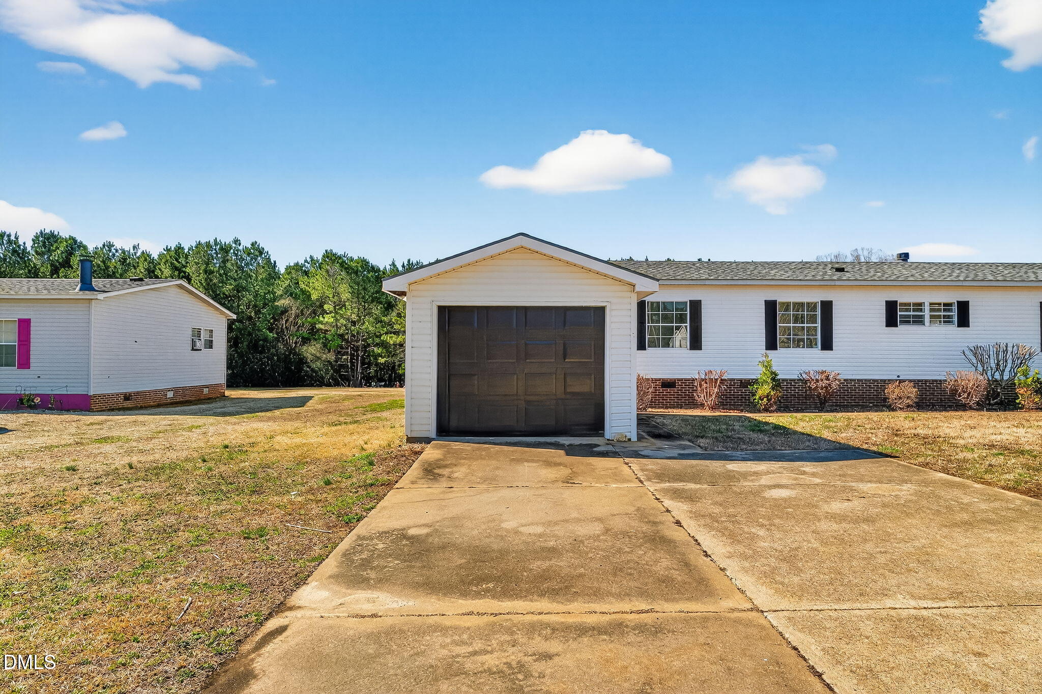 10015 Smith Road Middlesex, NC 27557 - Photo 5 of 48 a front view of house with yard and trees in the background
