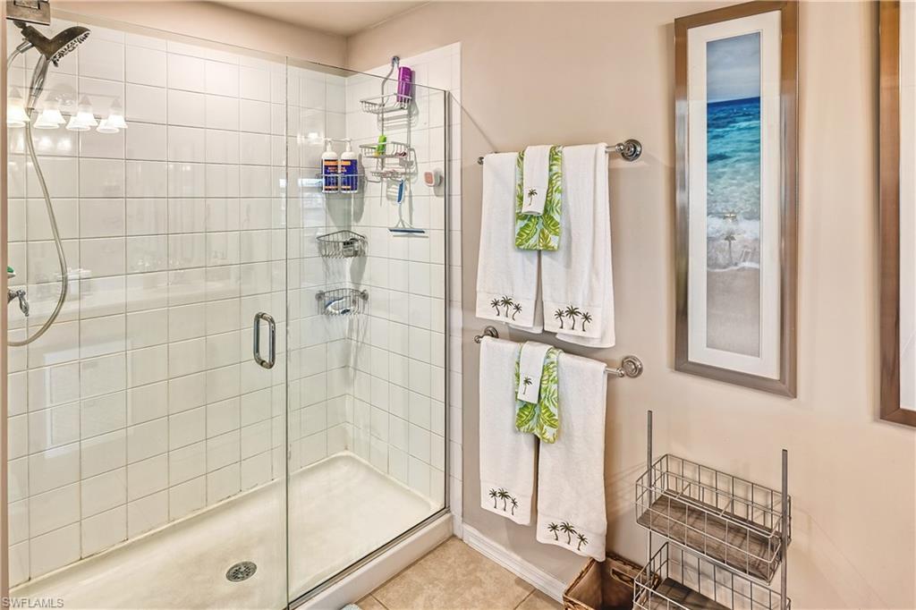 16211 Ravina Way, Unit 18 Naples, FL 34110 - Photo 14 of 24 a bathroom with a shower