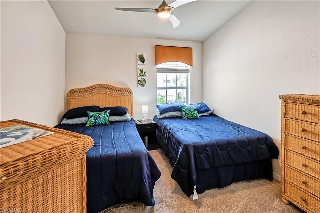 16211 Ravina Way, Unit 18 Naples, FL 34110 - Photo 15 of 24 a bedroom with a bed and a window