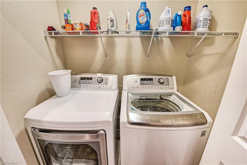 16211 Ravina Way, Unit 18 Naples, FL 34110 - Photo 18 of 24 a utility room with dryer and washer