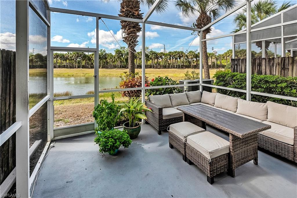 16211 Ravina Way, Unit 18 Naples, FL 34110 - Photo 19 of 24 a building outdoor space with patio furniture