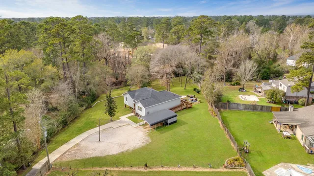 a view of a swimming pool with a yard