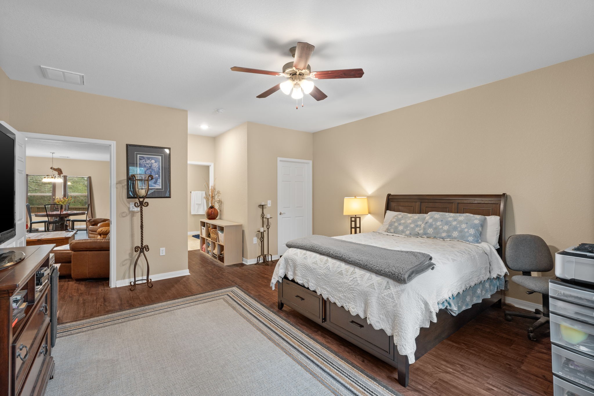 11706 Bogs Court Tomball, TX 77375 - Photo 14 of 42 a bedroom with a bed and ceiling fan