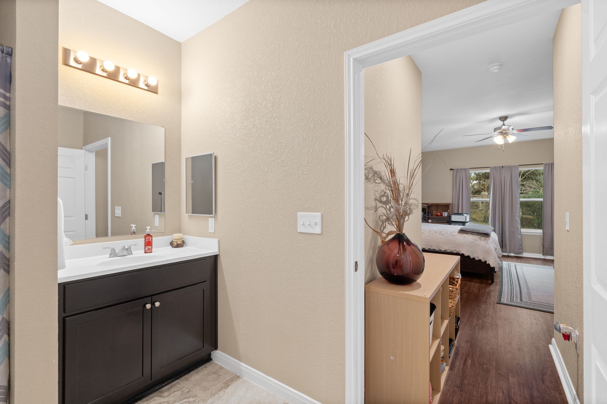11706 Bogs Court Tomball, TX 77375 - Photo 16 of 42 a en suite bathroom with a sink double vanity and a mirror