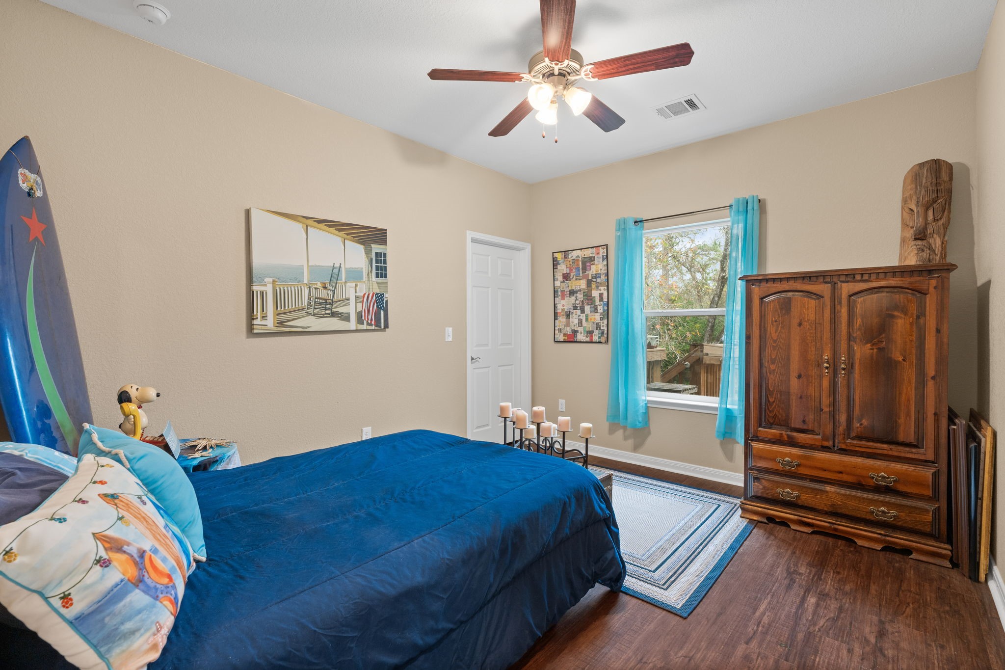 11706 Bogs Court Tomball, TX 77375 - Photo 17 of 42 a bedroom with a bed and wooden floor