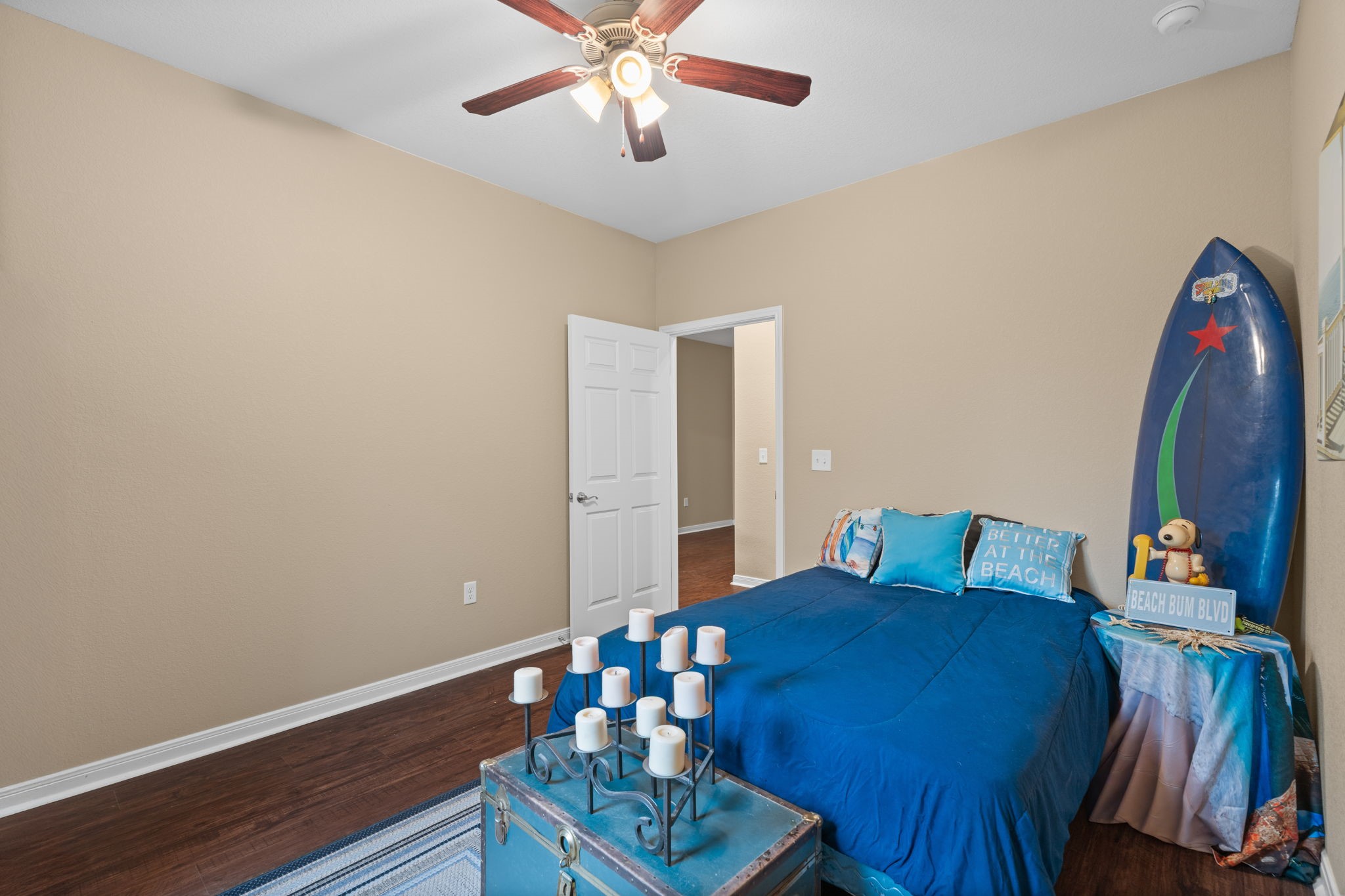 11706 Bogs Court Tomball, TX 77375 - Photo 18 of 42 a bedroom with a bed and a chandelier