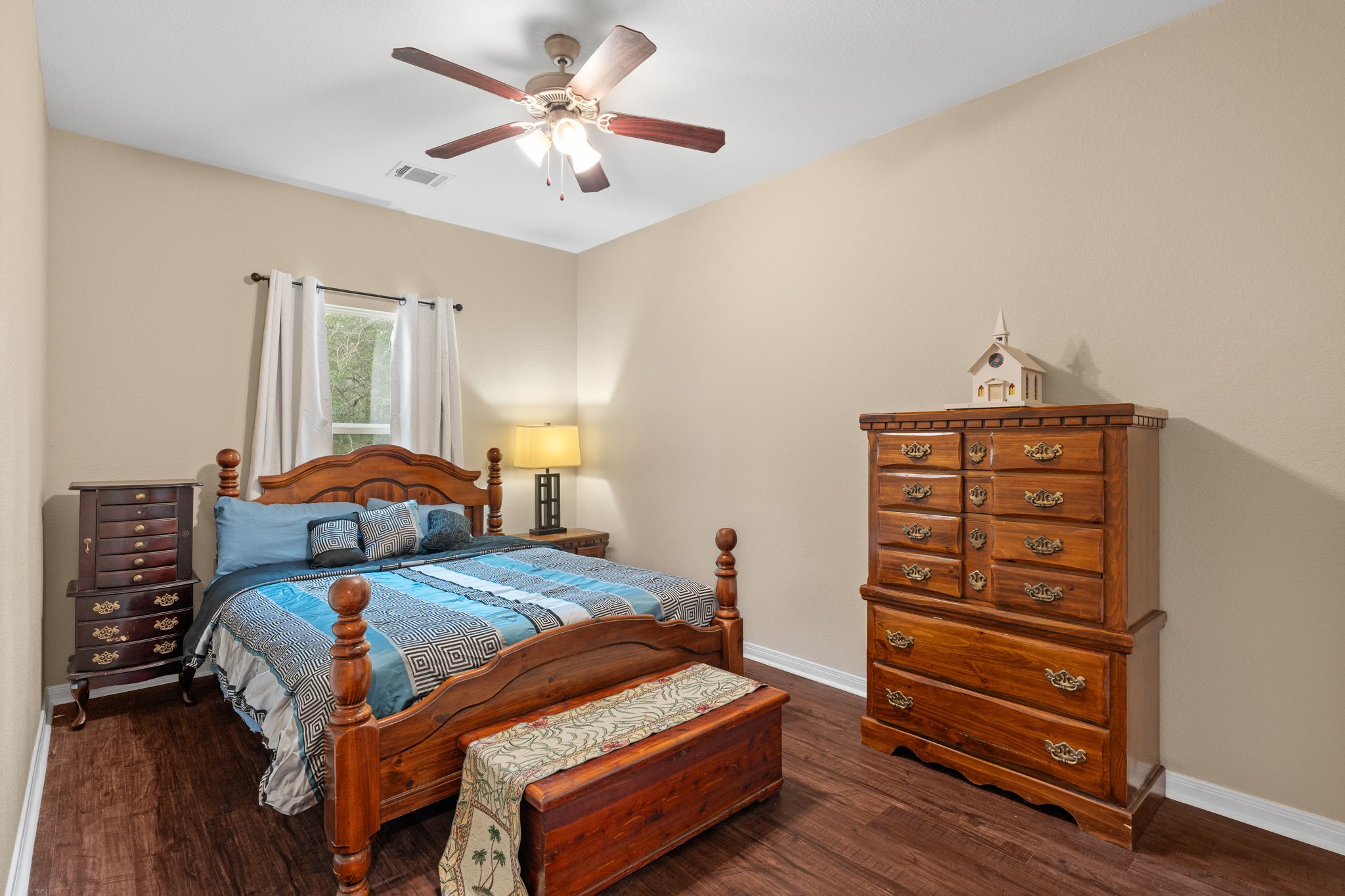 11706 Bogs Court Tomball, TX 77375 - Photo 20 of 42 a bedroom with a bed and a dresser