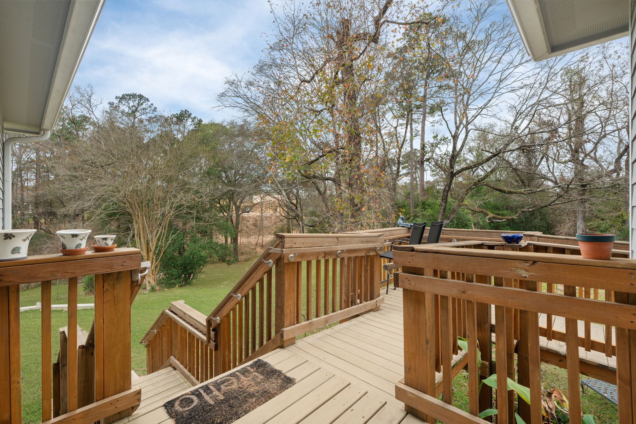 11706 Bogs Court Tomball, TX 77375 - Photo 27 of 42 a view of a deck with mountain view and wooden floor