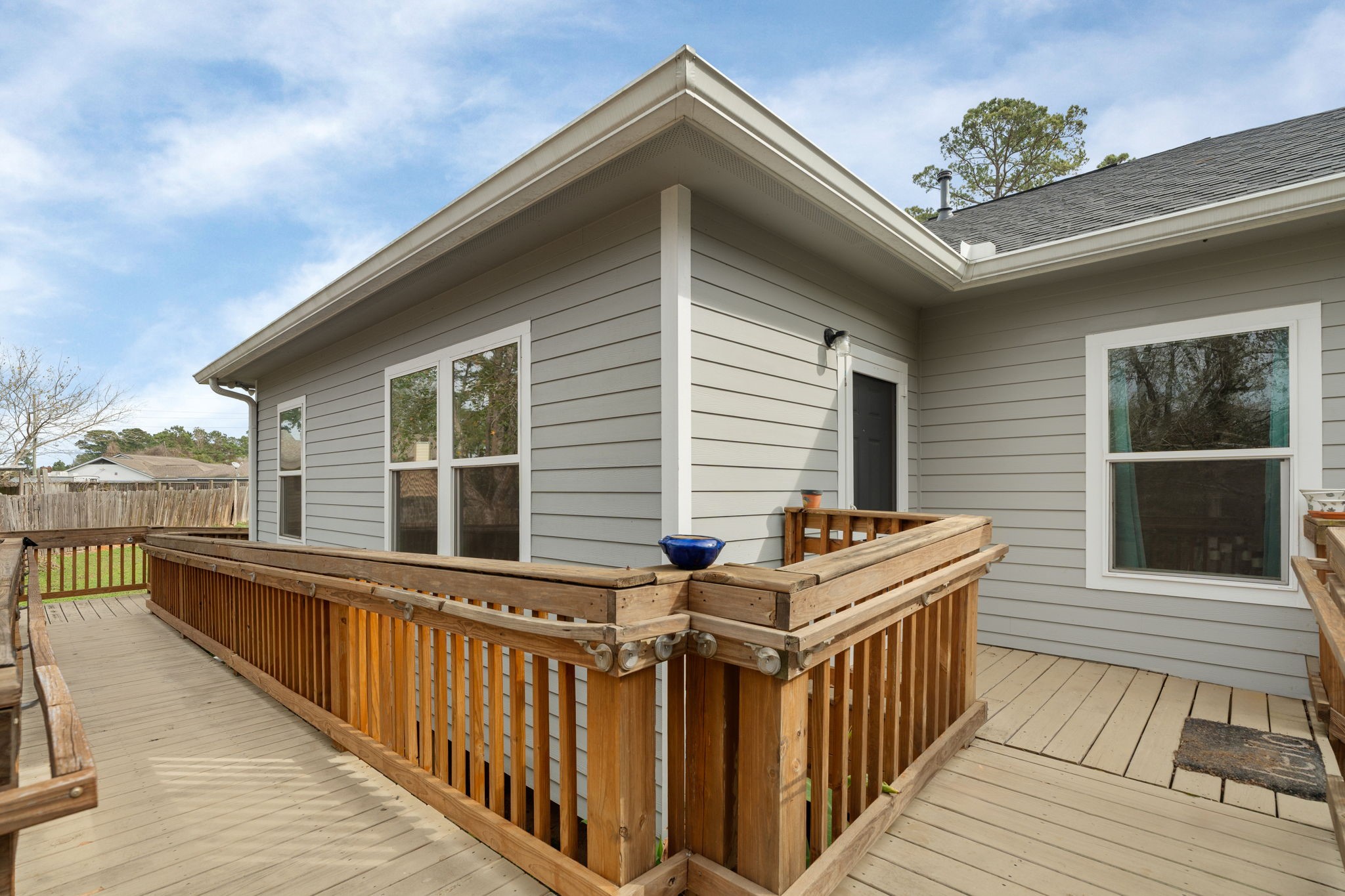 11706 Bogs Court Tomball, TX 77375 - Photo 28 of 42 a balcony with furniture and a wooden floor