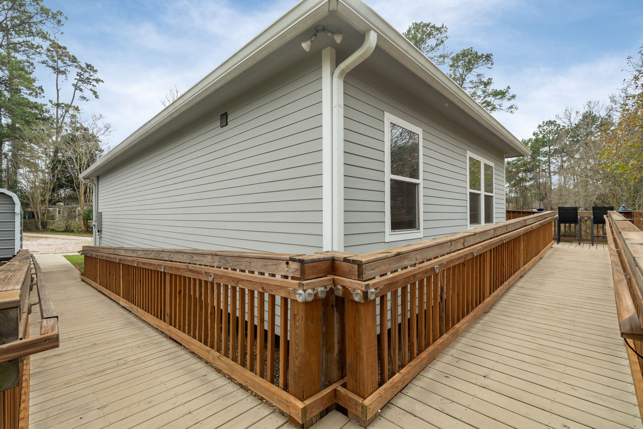 11706 Bogs Court Tomball, TX 77375 - Photo 29 of 42 a view of a house with wooden deck