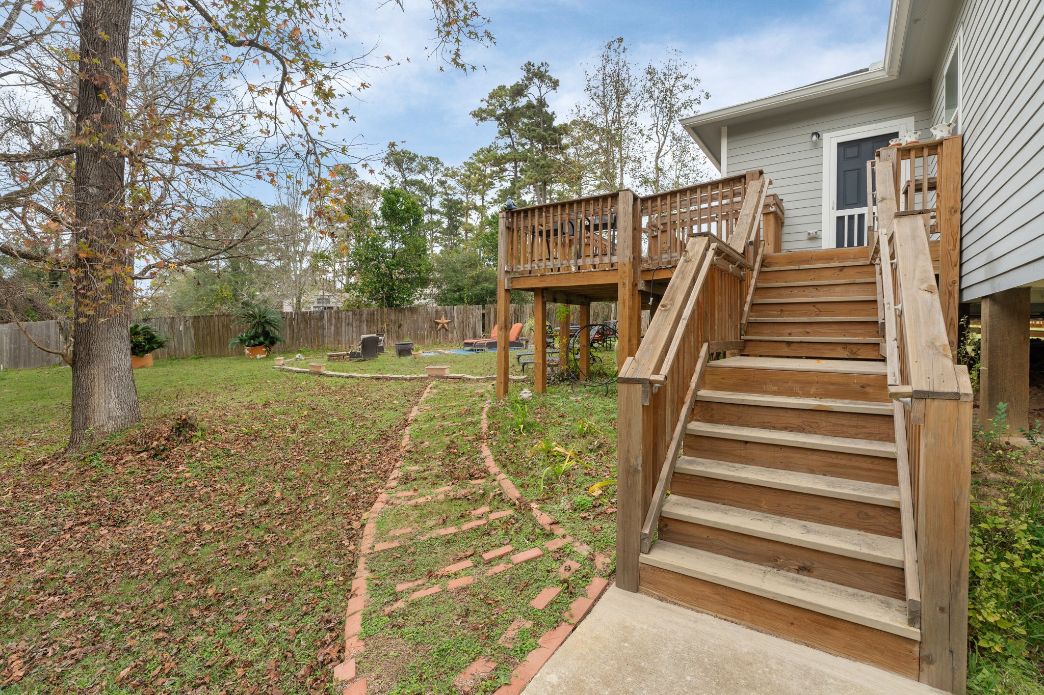 11706 Bogs Court Tomball, TX 77375 - Photo 30 of 42 a view of a house with a yard