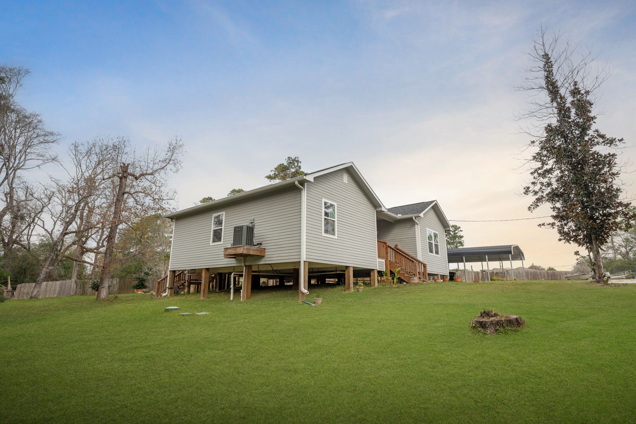 11706 Bogs Court Tomball, TX 77375 - Photo 35 of 42 a view of a house with a big yard and sitting area