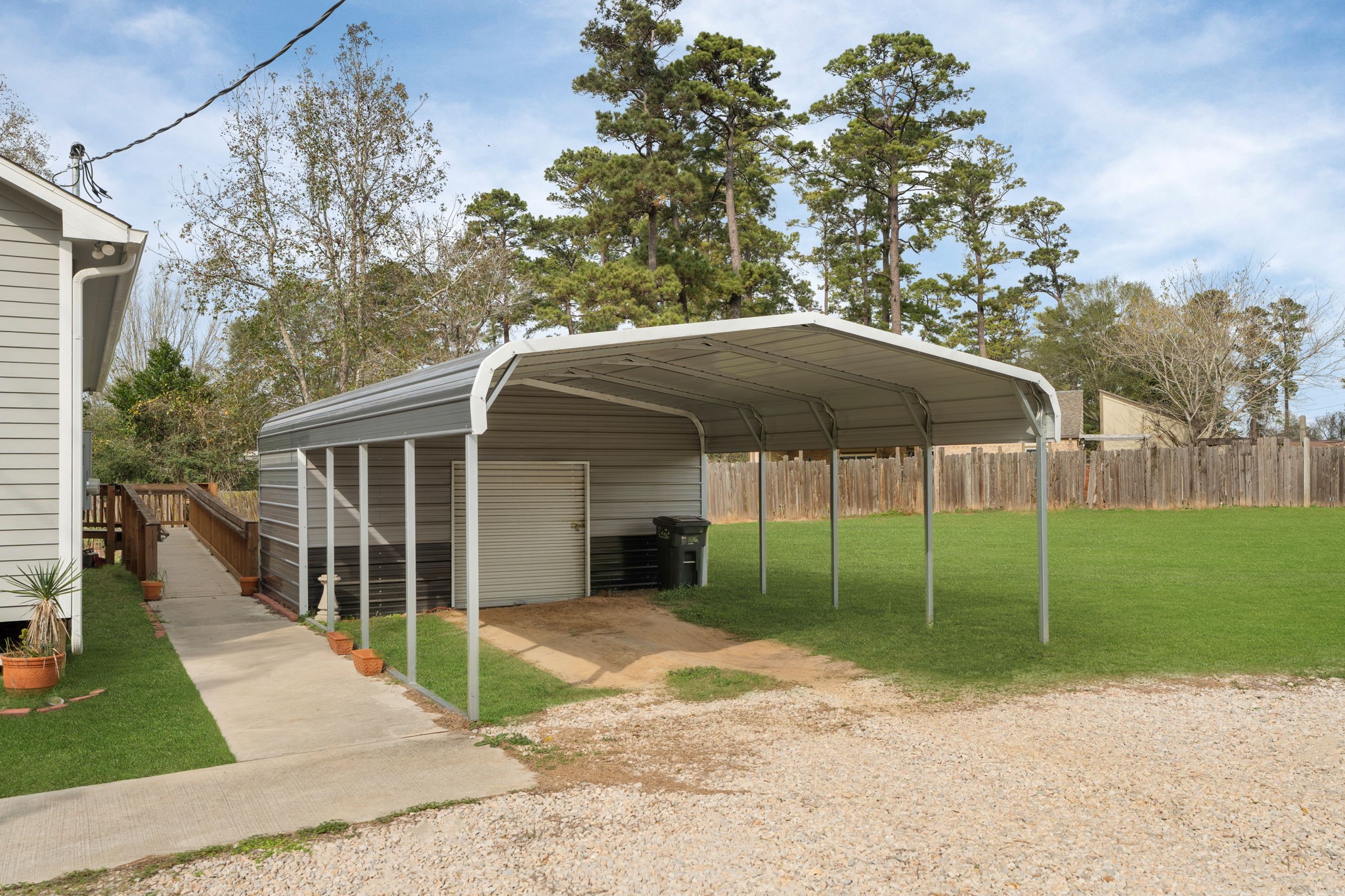 11706 Bogs Court Tomball, TX 77375 - Photo 38 of 42 a view of a house with backyard and a garden