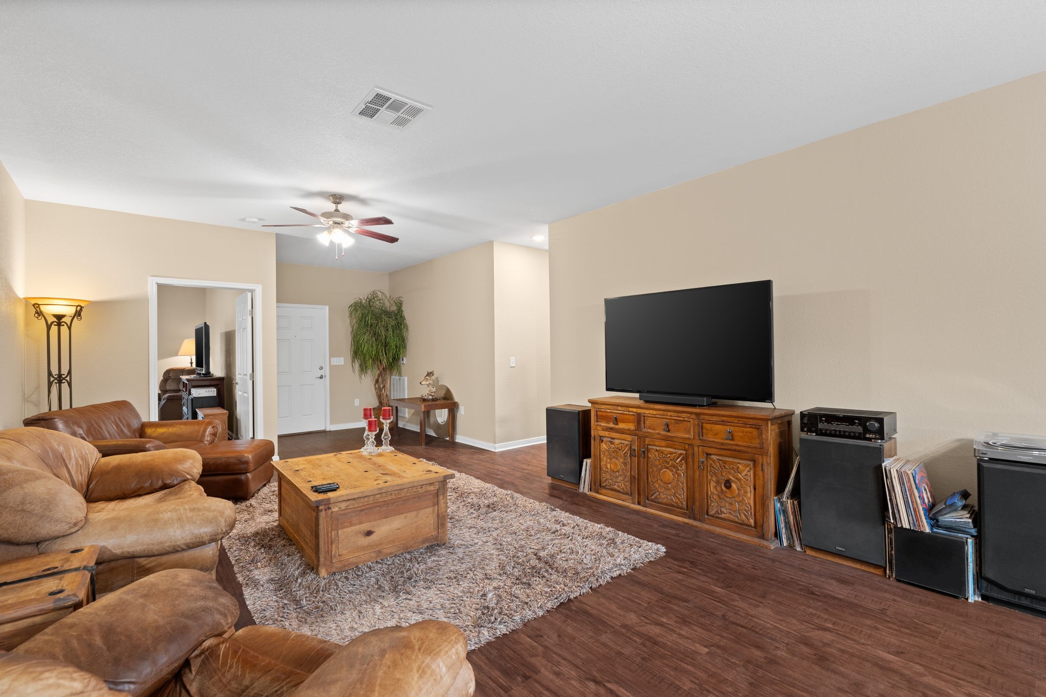 11706 Bogs Court Tomball, TX 77375 - Photo 7 of 42 a living room with furniture and a flat screen tv