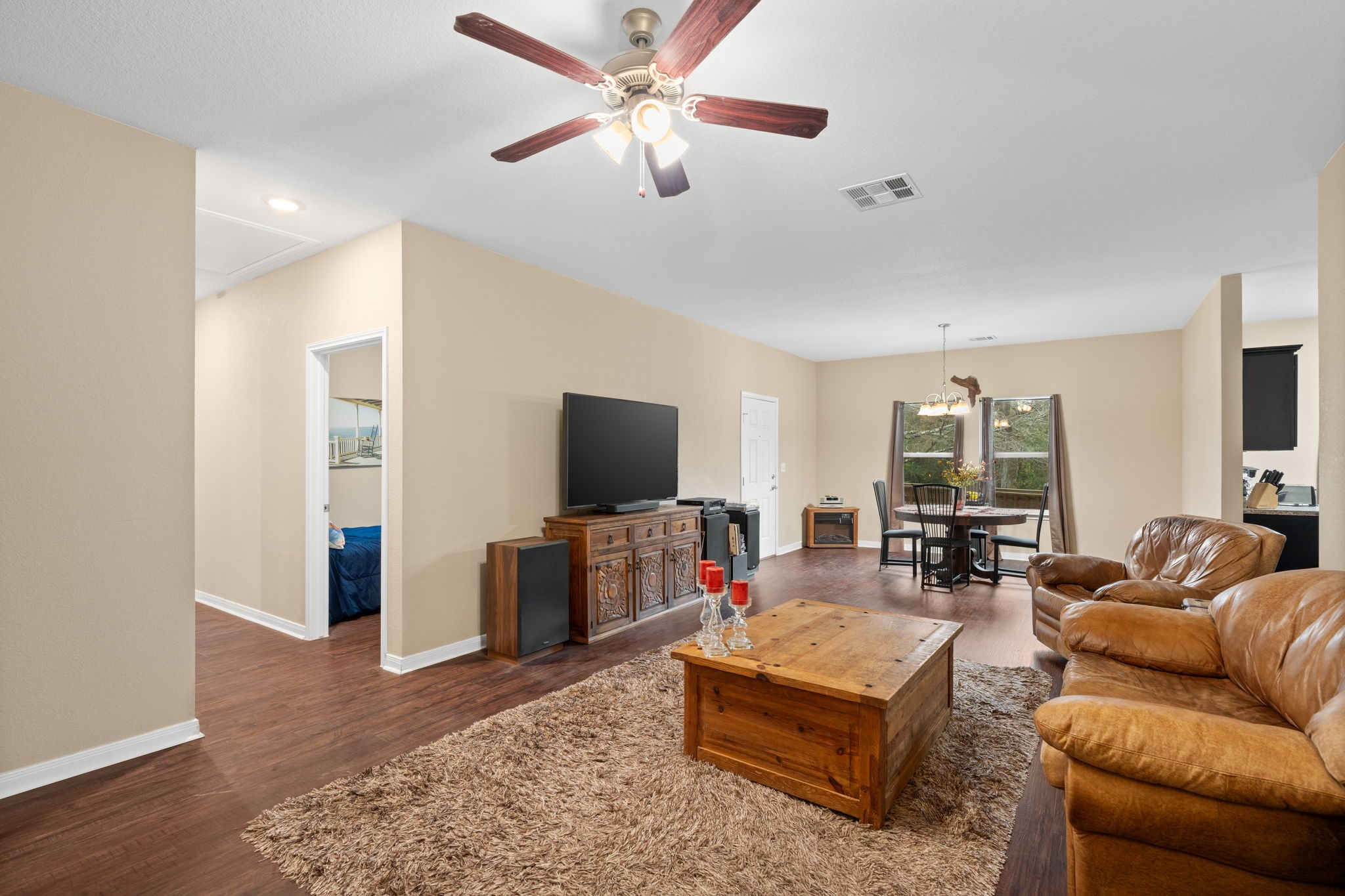 11706 Bogs Court Tomball, TX 77375 - Photo 9 of 42 a living room with furniture and a flat screen tv