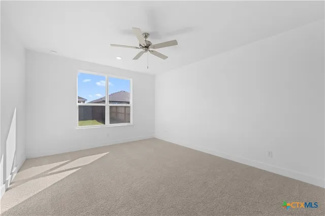 a view of a room with wooden floor and natural light