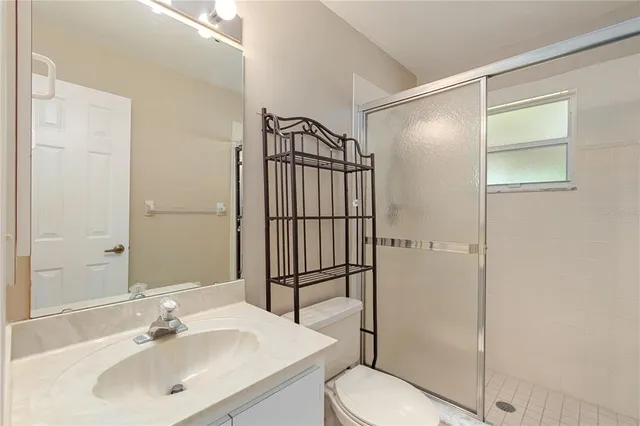 a view of a room with workspace windows and pool table