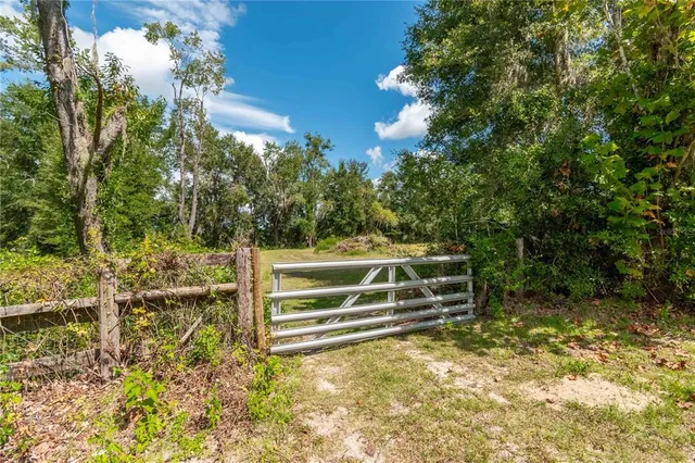 a view of outdoor space with deck and yard