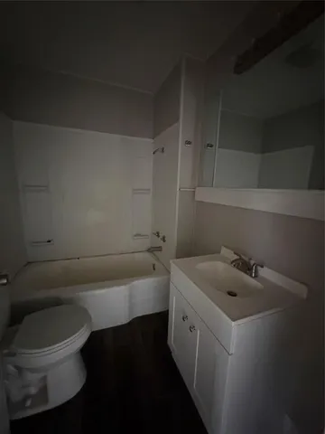 a bathroom with a sink toilet and bathtub