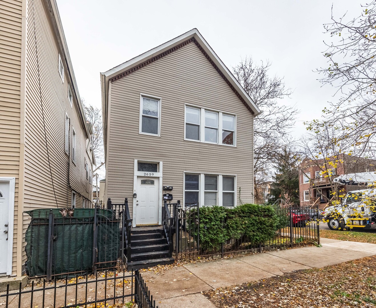 2659 West Homer Street, Unit 1F Chicago, IL 60647 - Photo 1 of 14 a view of a house with a yard