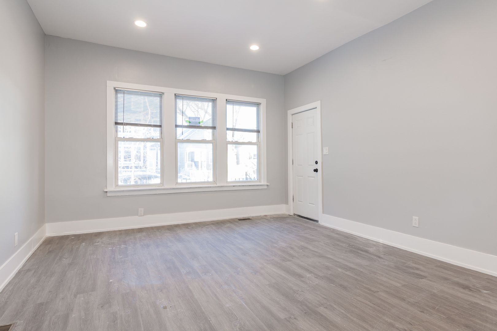 2659 West Homer Street, Unit 1F Chicago, IL 60647 - Photo 9 of 14 wooden floor in an empty room with a window